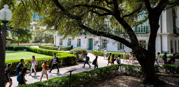 Students-between-classes-on-the-Main-Mall-with-Battle-Hall--oak-trees-2023-Fall