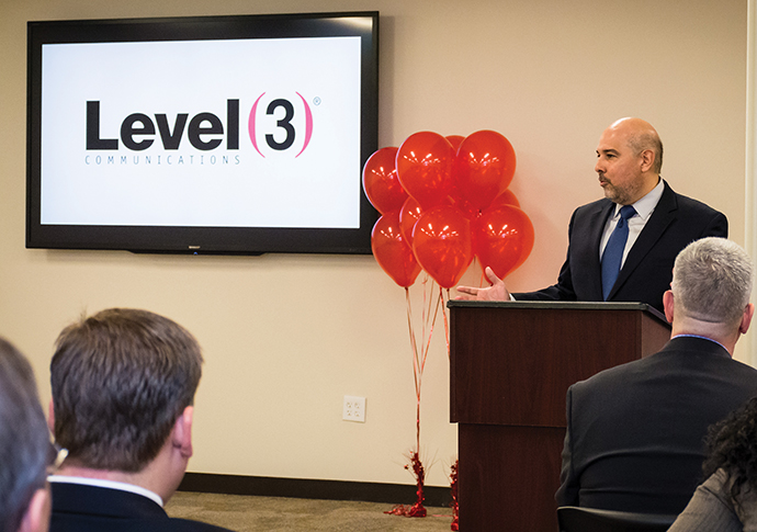 Jorge Magana of Level 3 Communications welcomes visitors to the official opening of the firm’s new operations center in Gwinnett County, Ga., near Atlanta.