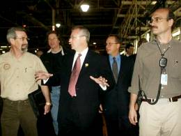 Gov. Bob Holden (pictured center while touring Ford's Kansas City-metro plant)